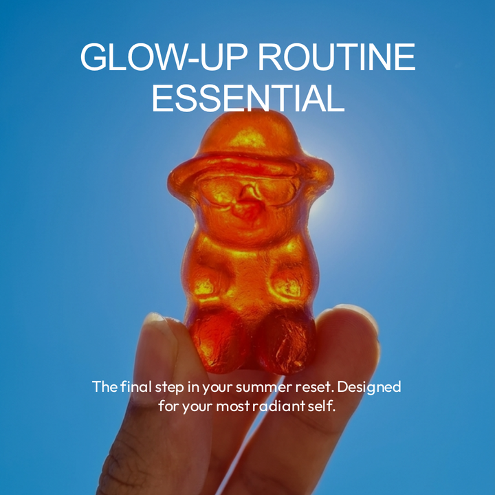 Close-up of an IvyBears Boost Tan gummy held against a blue sky with text Glow-Up Routine Essential for a radiant summer beauty routine.